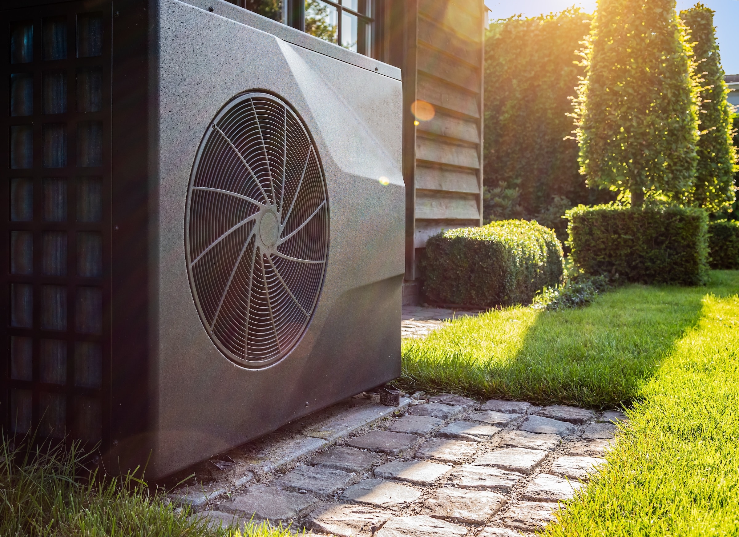 Heat Pump in sunny green yard